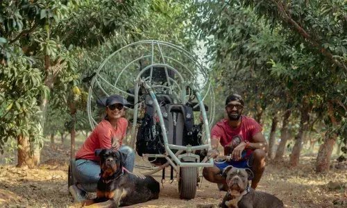 Adventure couple eyes air safari over Hussain Sagar