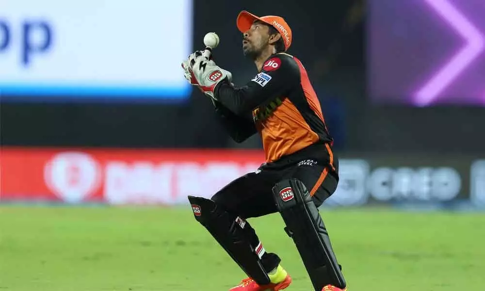 Wriddhiman Saha of Sunrisers Hyderabad takes a catch to dismiss Rahul Tripathi of Kolkata Knight Riders during the IPL match at the M. A. Chidambaram Stadium in Chennai on Sunday