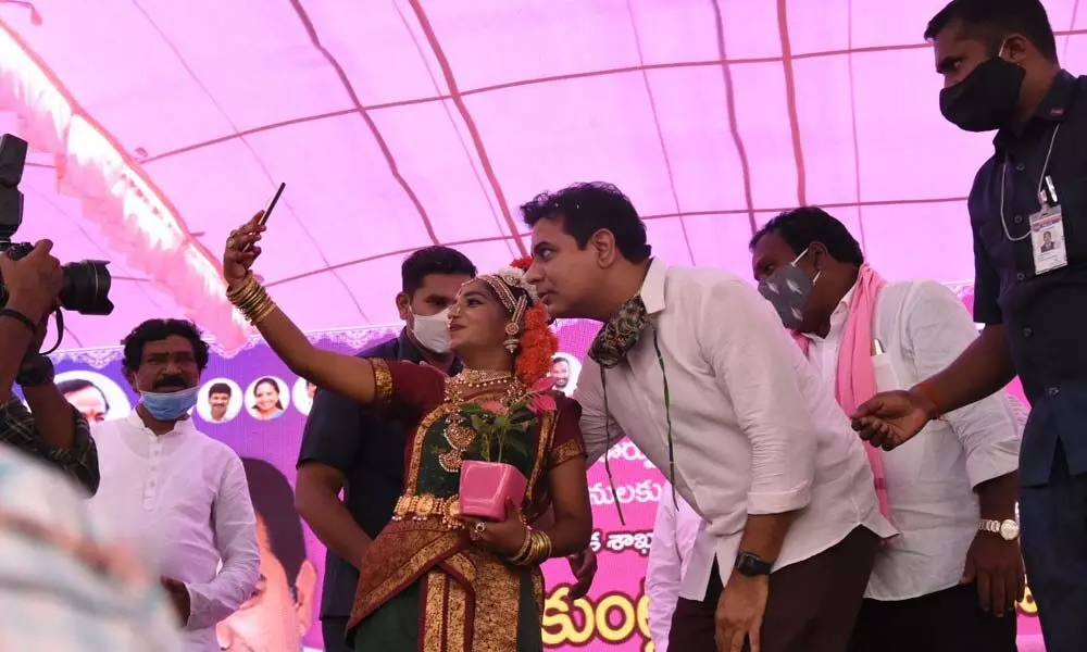 A girl taking a selfie with MA&UD Minister KT Rama Rao in Warangal on Monday