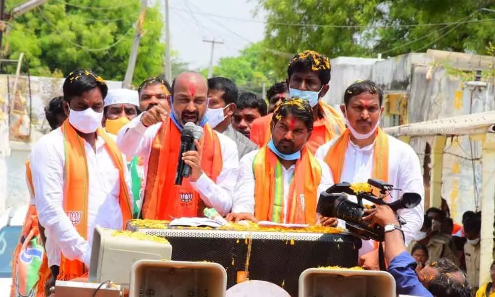 BJP State president Bandi Sanjay Kumar along with party candidate Dr P Ravi Naik addressing the people during election campaign in Sagar constituency on Monday