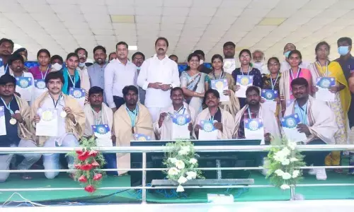 Health Minister Alla Nani with the ward/volunteers in Eluru on Monday