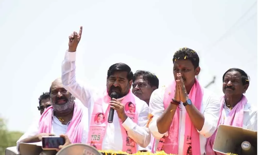 Energy Minister G Jagadish Reddy along with party candidate for Sagar byelection Nomula Bhagath Kumar addressing the gathering during a campaign in Anumula mandal on Tuesday