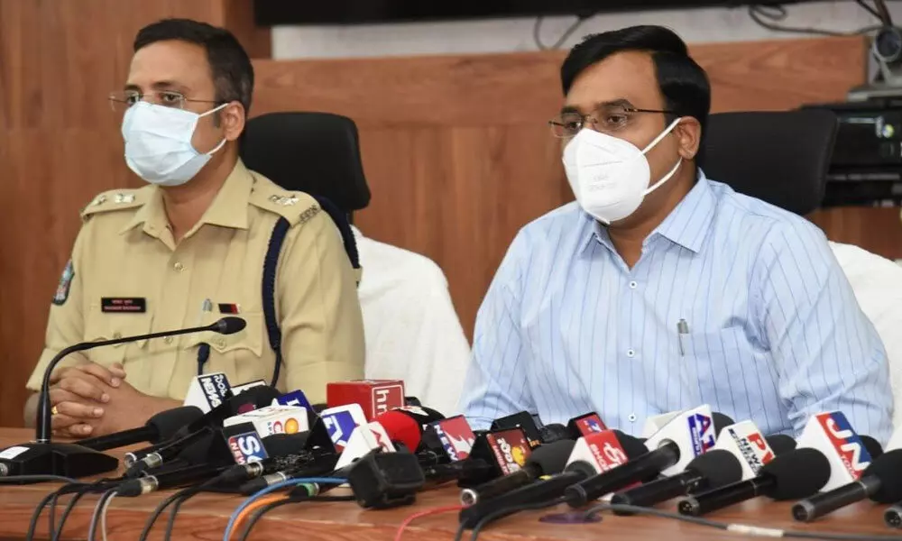 Collector and RO K V N Chakradhar Babu addressing media at Collectorate in Nellore on Thursday. SP Bhaskar Bhushan is also seen