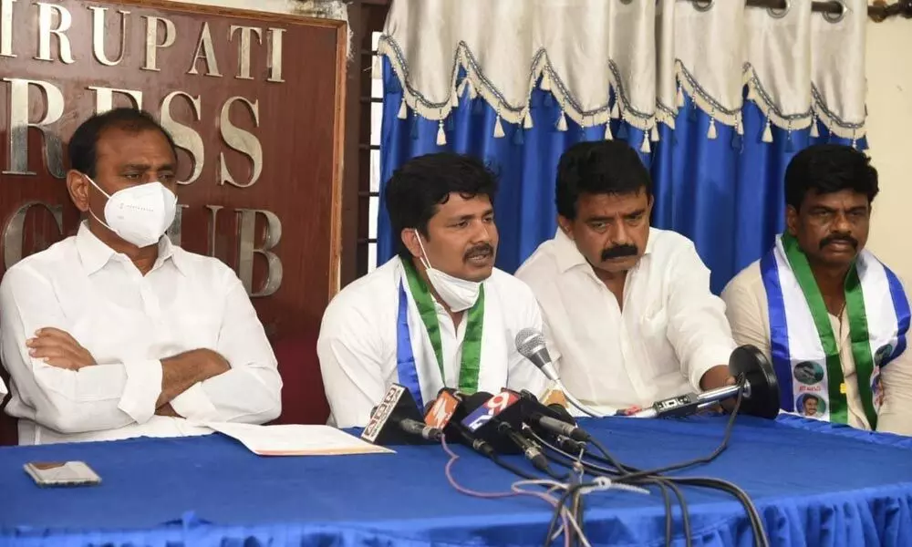 YSRCP Tirupati byelection candidate M Gurumoorthy speaking to media in Tirupati on Thursday. Minister Perni Venkatramaiah and MLA B Karunakar Reddy are also seen.