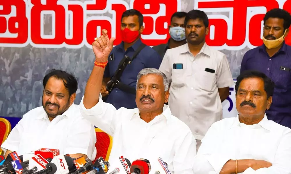 Minister for Panchayat Raj and Rural Development Peddireddi Ramachandra Reddy addressing the media in Tirupati on Saturday. Deputy Chief Minister K Narayana Swamy is also seen