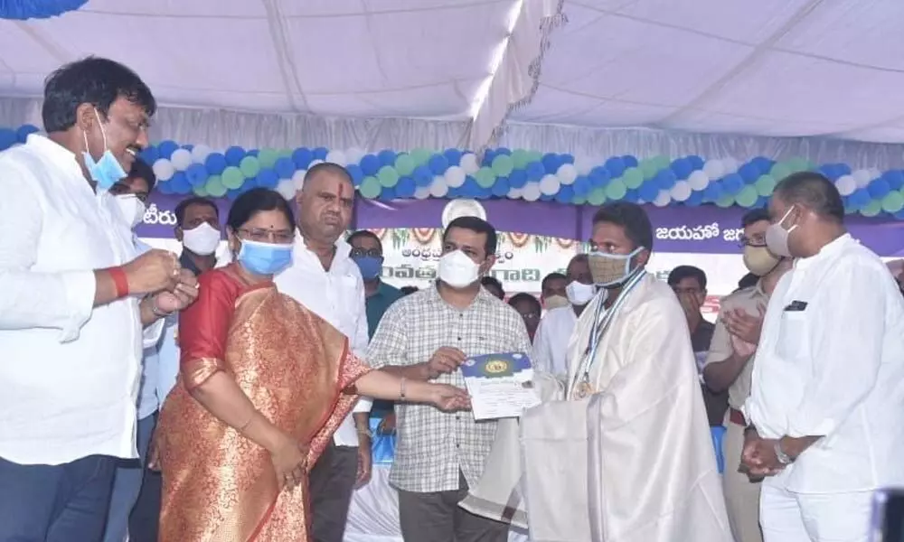 Volunteers receiving awards at NTR Stadium, Narsipatnam on Saturday