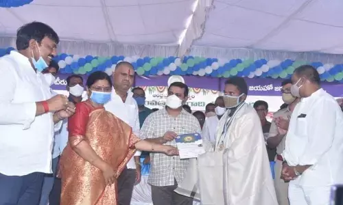 Volunteers receiving awards at NTR Stadium, Narsipatnam on Saturday