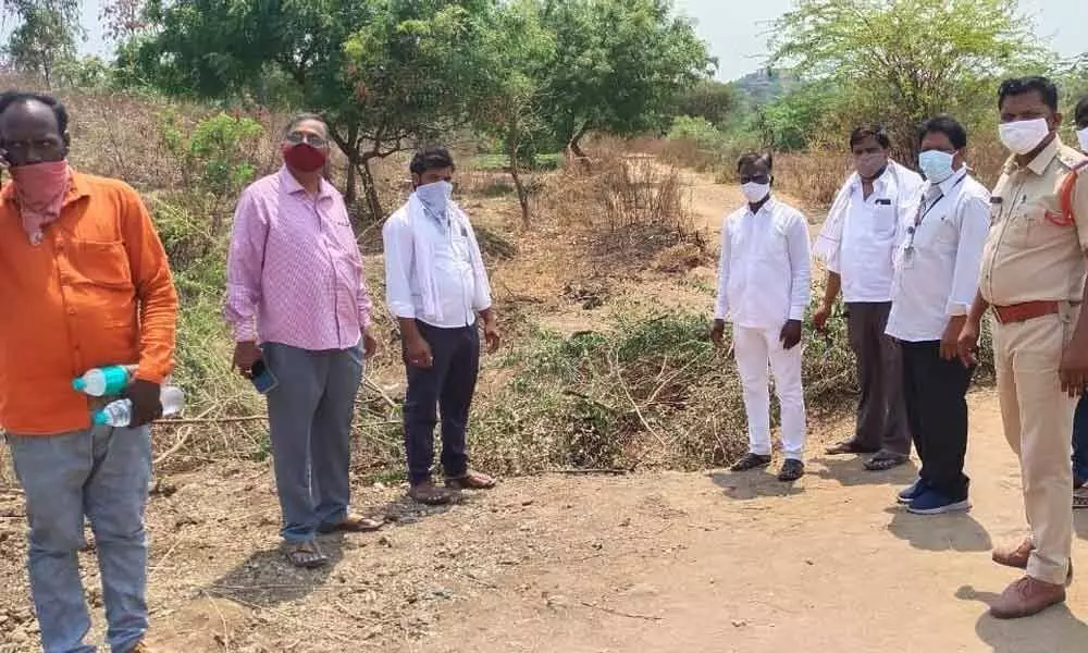 Maddunur SI Raju observing the fencing set up at a village in Jukkal manal