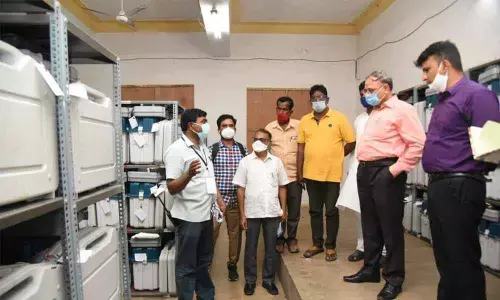 Election officers and collectors seal on strong room for EVMs at SV Arts College in Tirupati on Sunday