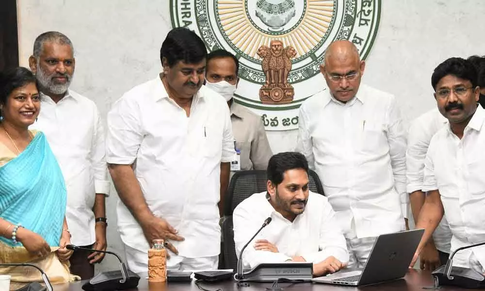 Chief Minister Y S Jagan Mohan Reddy releasing first instalment of Jagananna Vidya Deevena into accounts of students mothers  at camp office in Tadepalli on Monday