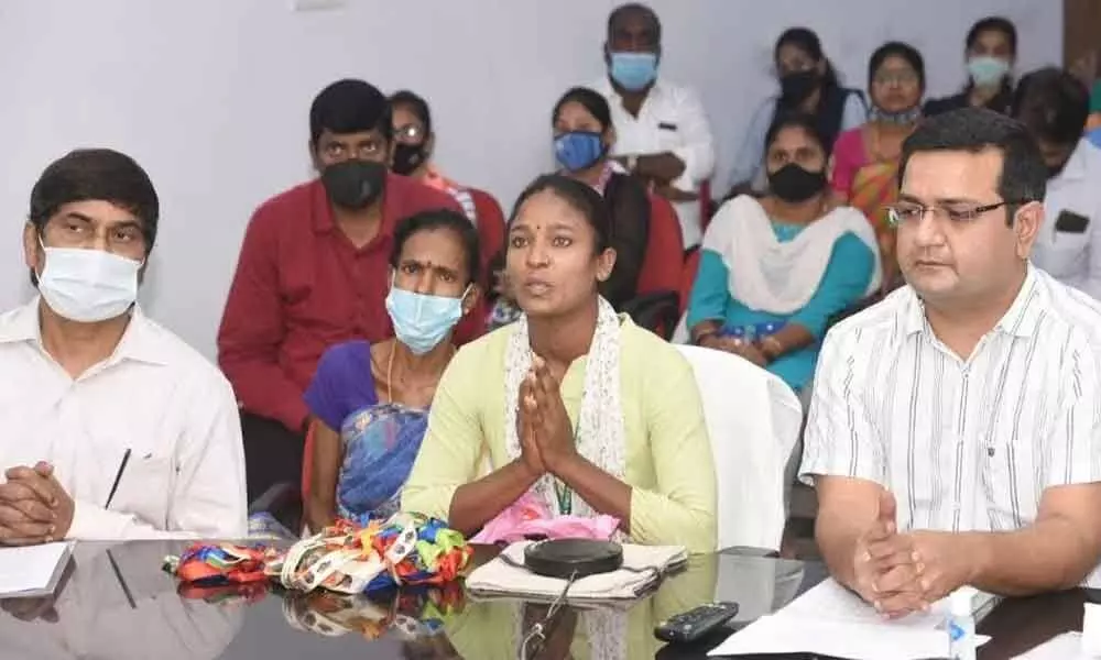 District Collector V Vinay Chand (right), Andhra University Vice-Chancellor PVGD Prasad Reddy and students in Visakhapatnam on Monday taking part in video conference with Chief Minister Y S Jagan Mohan Reddy on ‘Jagananna Vidya Deevena’ scheme