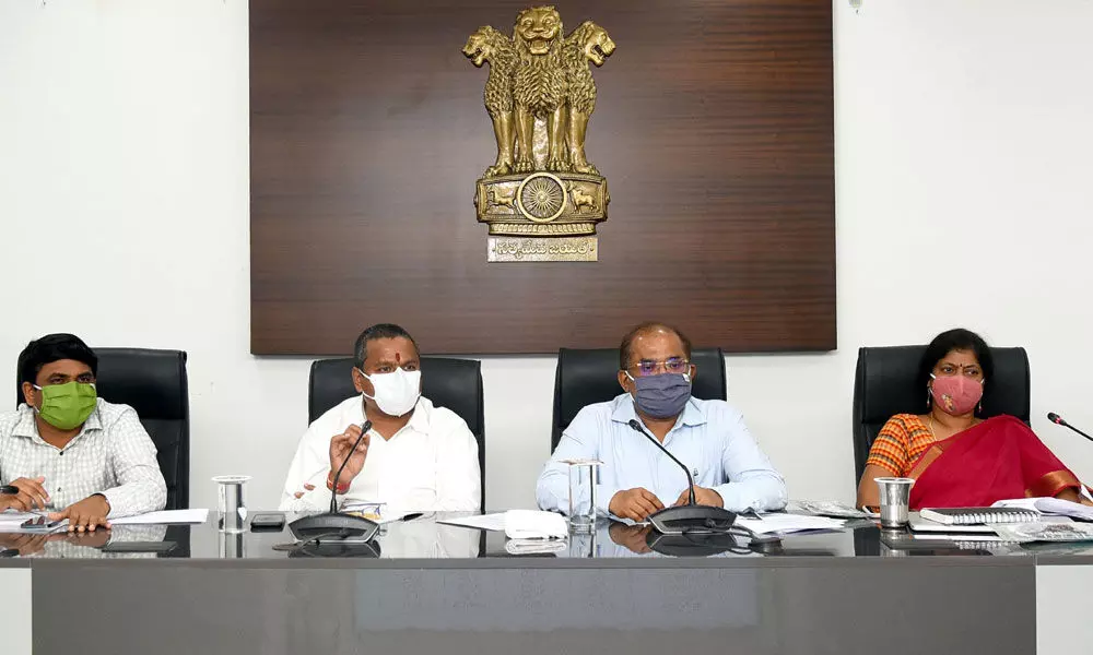 Endowments Minister Velampalli Srinivas addressing the review meeting on Covid cases in Vijayawada on Tuesday