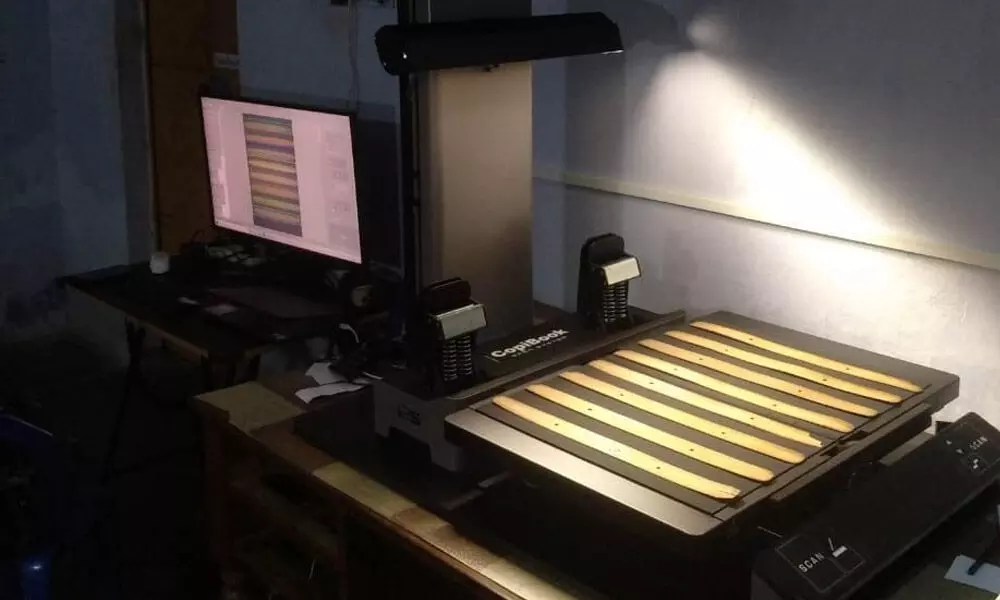 Scanning the palm leaf manuscripts using high resolution open type scanner