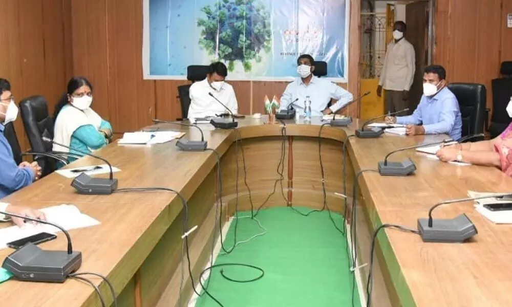 District Collector M Hari Narayanan reviewing the Covid situation with officials in Tirupati on Tuesday. Corporation Commissioner PS Girisha and others are also seen.