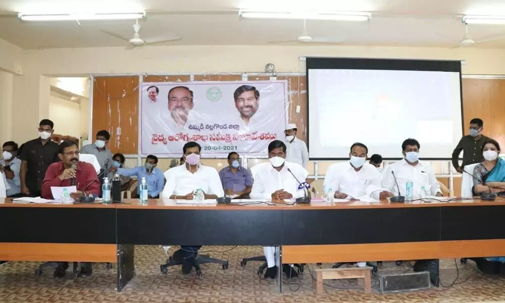 Ministers Jagadish Reddy and Eatala Rajender addressing the medical officials at a review meeting on corona at the Collectorate in Suryapet on Tuesday