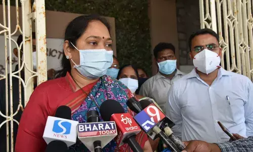 Home Minister Mekathoti Sucharitha addressing the media at collectorate in Guntur city on Tuesday. District collector Vivek Yadav is also seen.