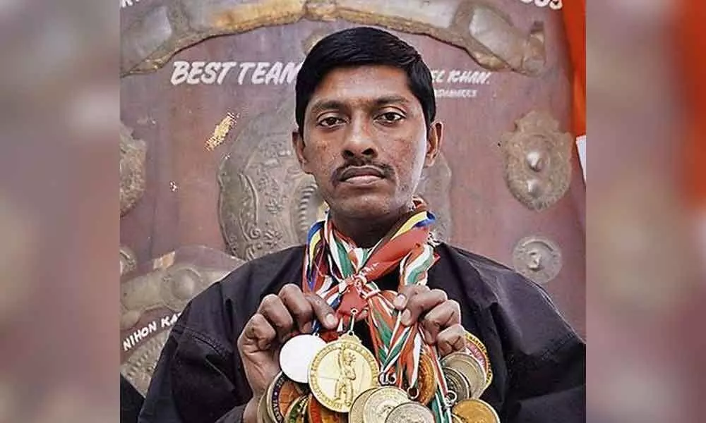 A global martial arts champion living in penury