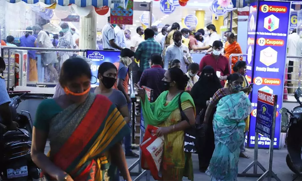 People throng provisions store to purchase groceries at Thirthakattu street in Tirupati