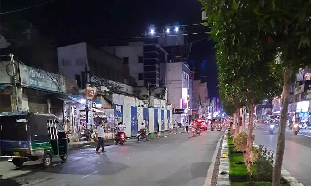 Eluru Road in Vijayawada wears a deserted look as night curfew comes into force at 10 pm on Saturday