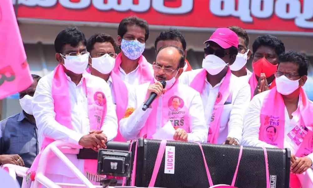 Home Minister Mahmod Ali participating in road show during the election campaign programme in Khammam on Saturday