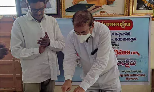 Principal District Judge (PDJ) G Ramakrishna cutting a cake at the District Bar Association Hall in Srikakulam on Saturday on the occasion of Justice N V Ramana taking charge as the Chief Justice of India.
