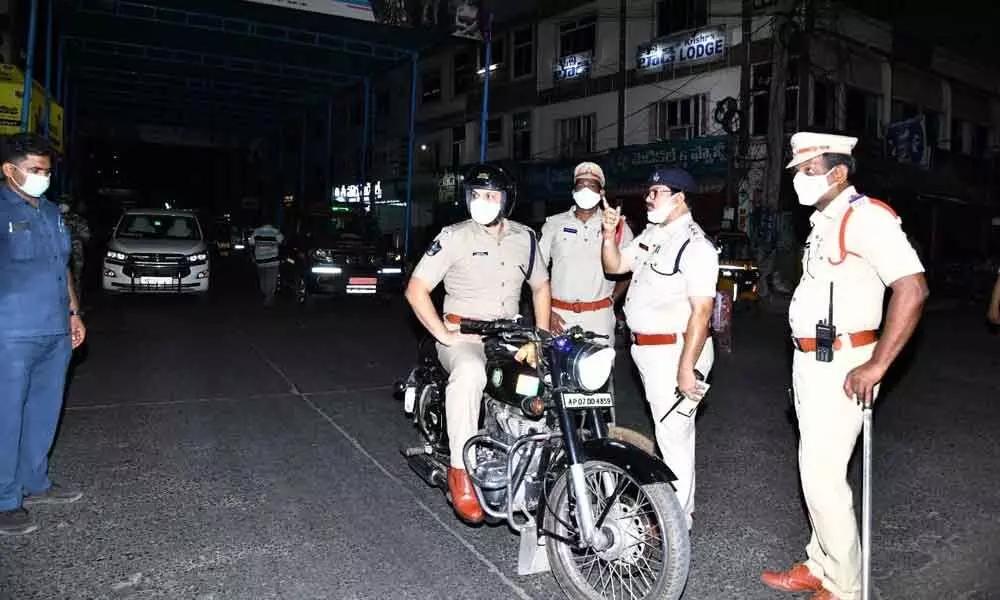 Prakasam SP Siddharth Kaushal inspecting implementation of night curfew in Ongole on Saturday night