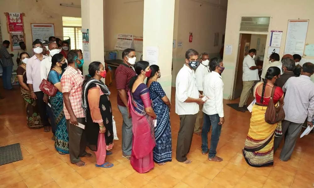 People wait for their turn to take vaccine at a PSC centre in SVIMS Hospital in Tirupati on Monday