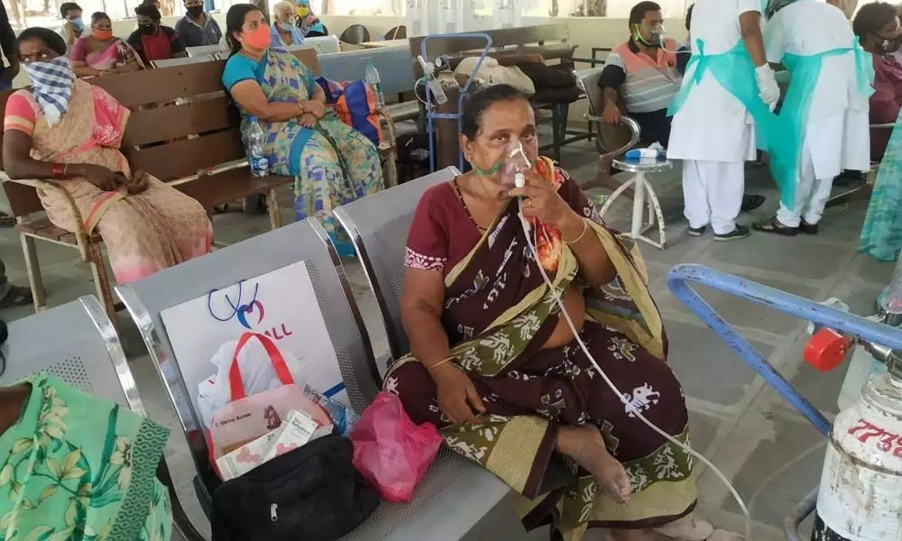Doctors offering treatment at Covid OP in GGH Ongole on Monday
