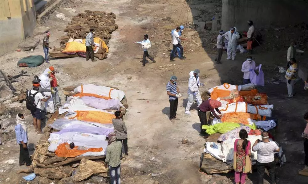 Corpses wait in 20-hour queues for last rites at crematoriums