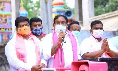 Panchayat Raj Minister Errabelli Dayakar Rao addressing a roadshow in Warangal on Tuesday. Warangal East MLA Nannapuneni Narender (left) is also seen