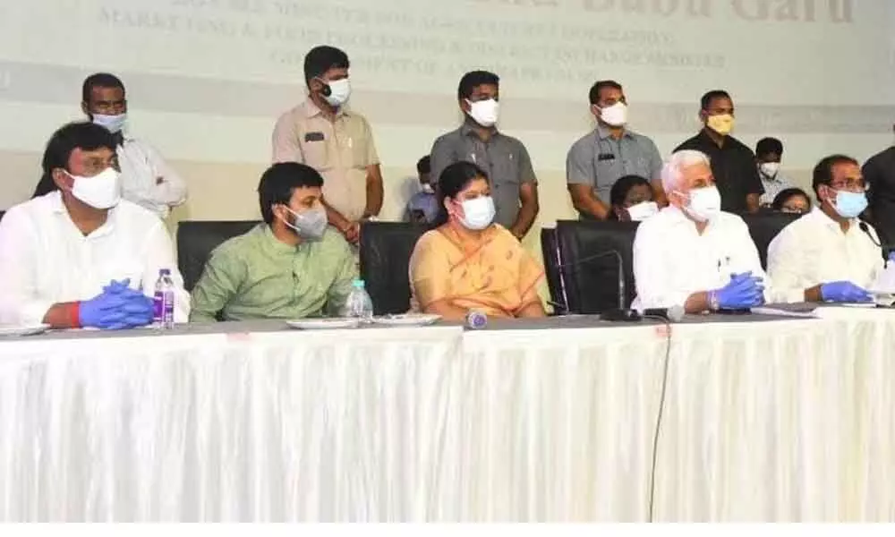 District in-charge and Agriculture Minister Kurasala Kannababu speaking at a review meeting held  in Visakhapatnam on Wednesday. MP V Vijayasai Reddy is also seen.