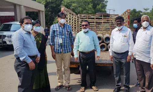 Prakasam district Collector Dr Pola Bhaskara receiving oxygen cylinders from MP Magunta representatives at GGH Ongole on Wednesday