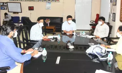District Collector V Vinay Chand reviewing with the officials concerned at AMC College in Visakhapatnam on Thursday