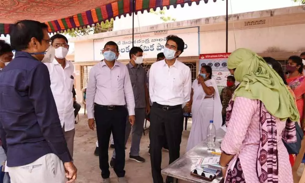 District Collector D Muralidhar Reddy inspecting the Covid vaccination centre along with Kakinada Municipal Commissioner Swapnil Dinakar Pundkar at  Municipal High School in Kakinada on Friday
