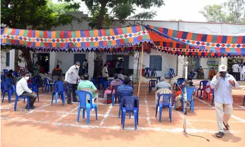 People waiting in queue for vaccine