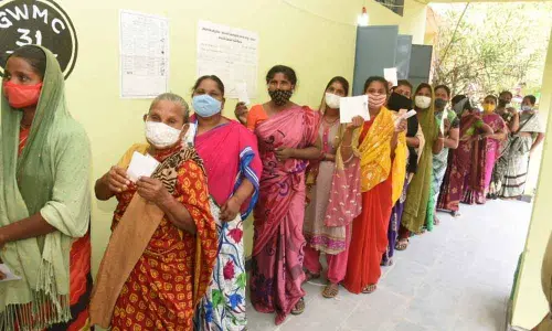Voters lined up at a polling station for the 31st division in Warangal on Friday