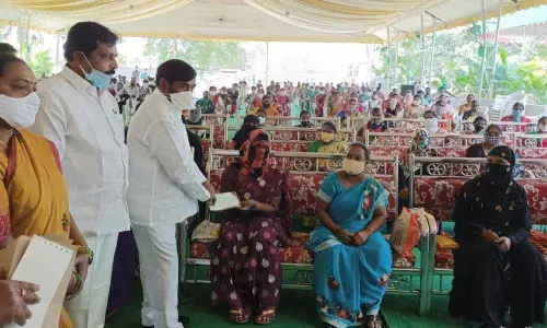 Minsiter Jagadish Reddy distributing Kalayana Lakshmi and Shaadi Mubarak cheques to beneficiaries in Suryapet on Friday
