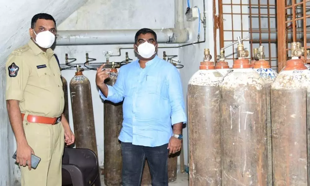 District collector G Veera Pandiyan and Superintendent of Police Dr Fakkeerappa Kaginelli inspecting the oxygen stocks at KS Care hospital in Kurnool on Saturday