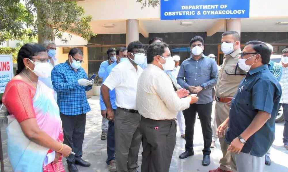 Collector Dr Pola Bhaskara and SP Siddharth Kaushal interacting with hospital authorities over arrangements for treatment at GGH in Ongole on Saturday