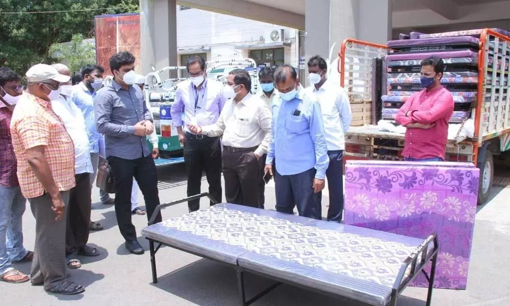 Joint Collector TS Chetan receiving 50 beds and 14 oxygen cylinders from Magunta’s office staff at GGH in Ongole on Saturday