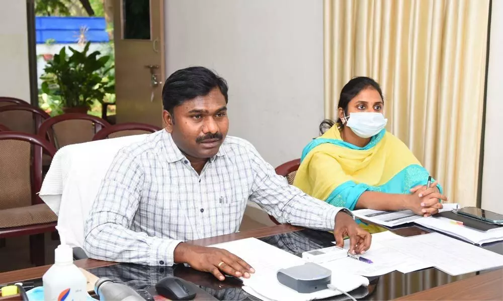 Collector Gandham Chandrudu and Joint Collector A Siri addressing officials through a video-conference in Anantapur on Saturday