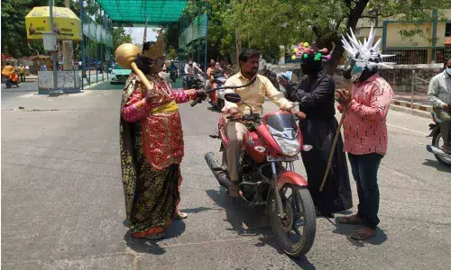Artistes dressed like Yama, Satan and coronavirus creating awareness on precautions to protect from the coronavirus at Church centre in Ongole on Sunday
