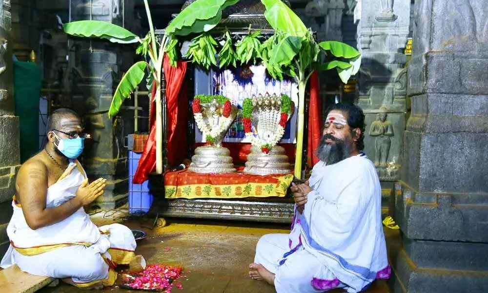 Archakas performing Rahu Kethu Pooja at Srikalahasti temple on Tuesday. The devasthanam has resumed online sevas like last year.