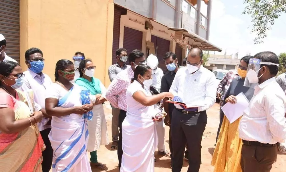 Collector KVN Chakradhar Babu interacting with the staff members at the Covid care centre in Gudur in Nellore district on Tuesday