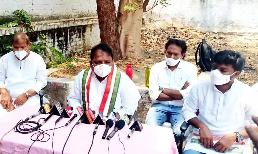 APCC president Dr S Sailajanath addressing a media conference at the party office in Kurnool on Tuesday. Former MLC M Sudhakar Babu is also seen.