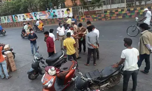 Police officials imposing Covid norms in Vijayawada on Tuesday