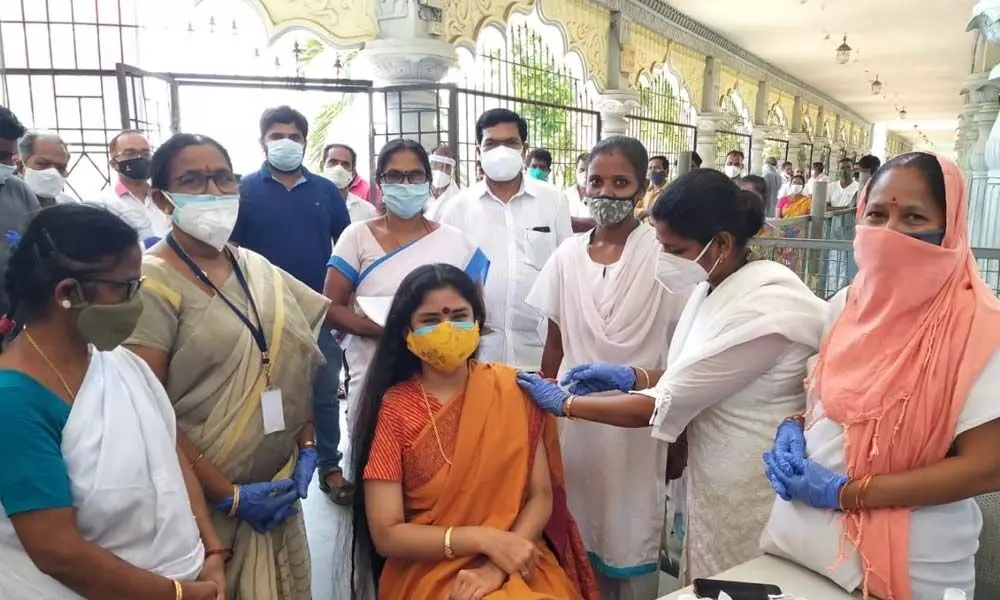 Simhachalam Devasthanam chairperson Sanchaita Gajapathi Raju taking the first shot of Covid-19 vaccine at a camp held in Simhachalam in Visakhapatnam on Wednesday