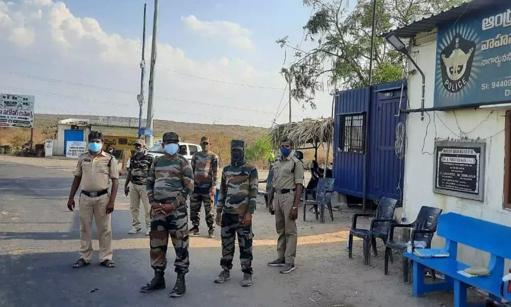 Police at AP-TS check post at Nagarjuna Sagar in Nalgonda district on Wednesday