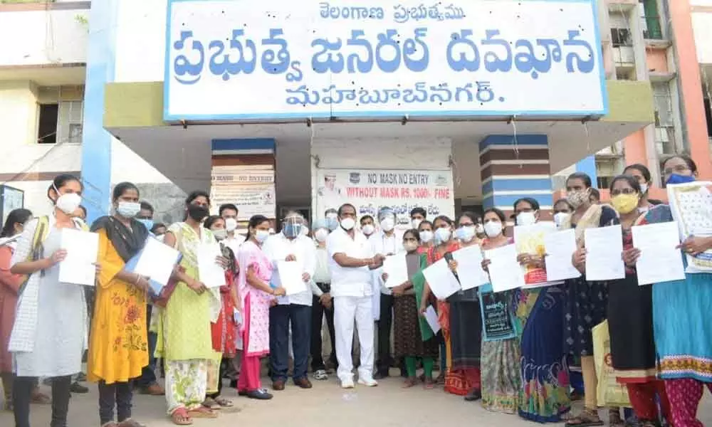 Excise and Prohibition Minister V Srinivas Goud handing over appointment letters to the newly appointed 12 Ayush doctors and 31 nurses at the Government General Hospital in Mahbubnagar on Thursday