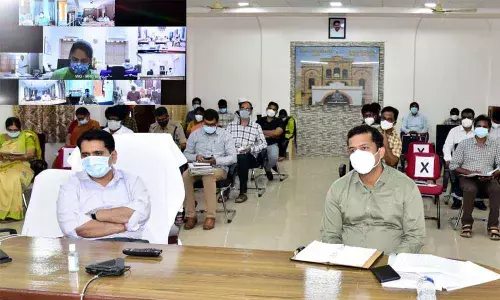 Collector Karthikeya Mishra holding a videoconference with officials on Covid issues from the Collectorate in Eluru